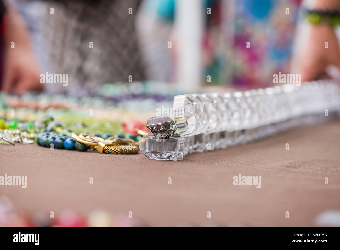 Engagement rings in boxes in a row on colorful background. Expensive ...