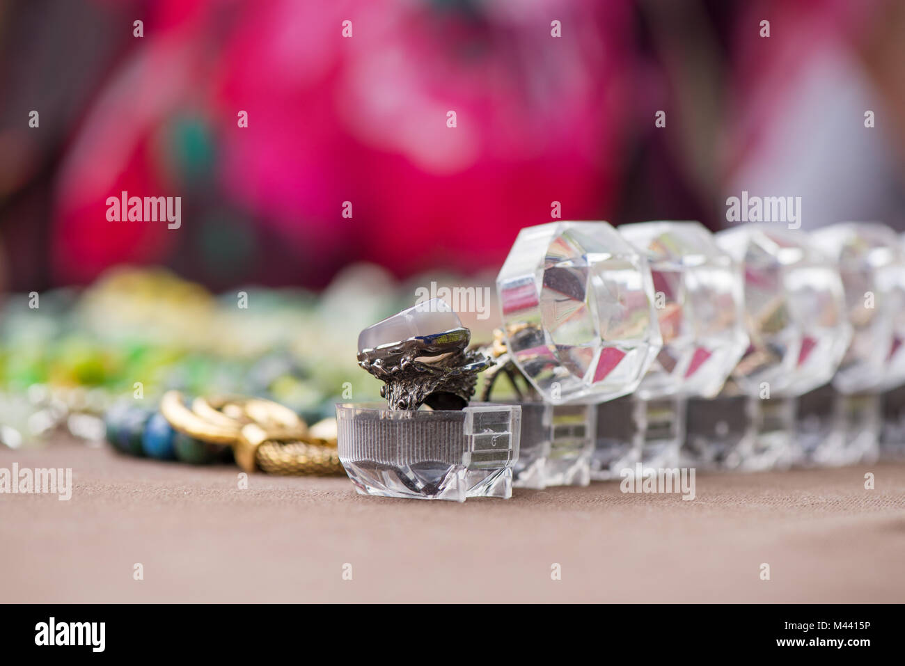 Engagement rings in boxes in a row on colorful background. Expensive ...