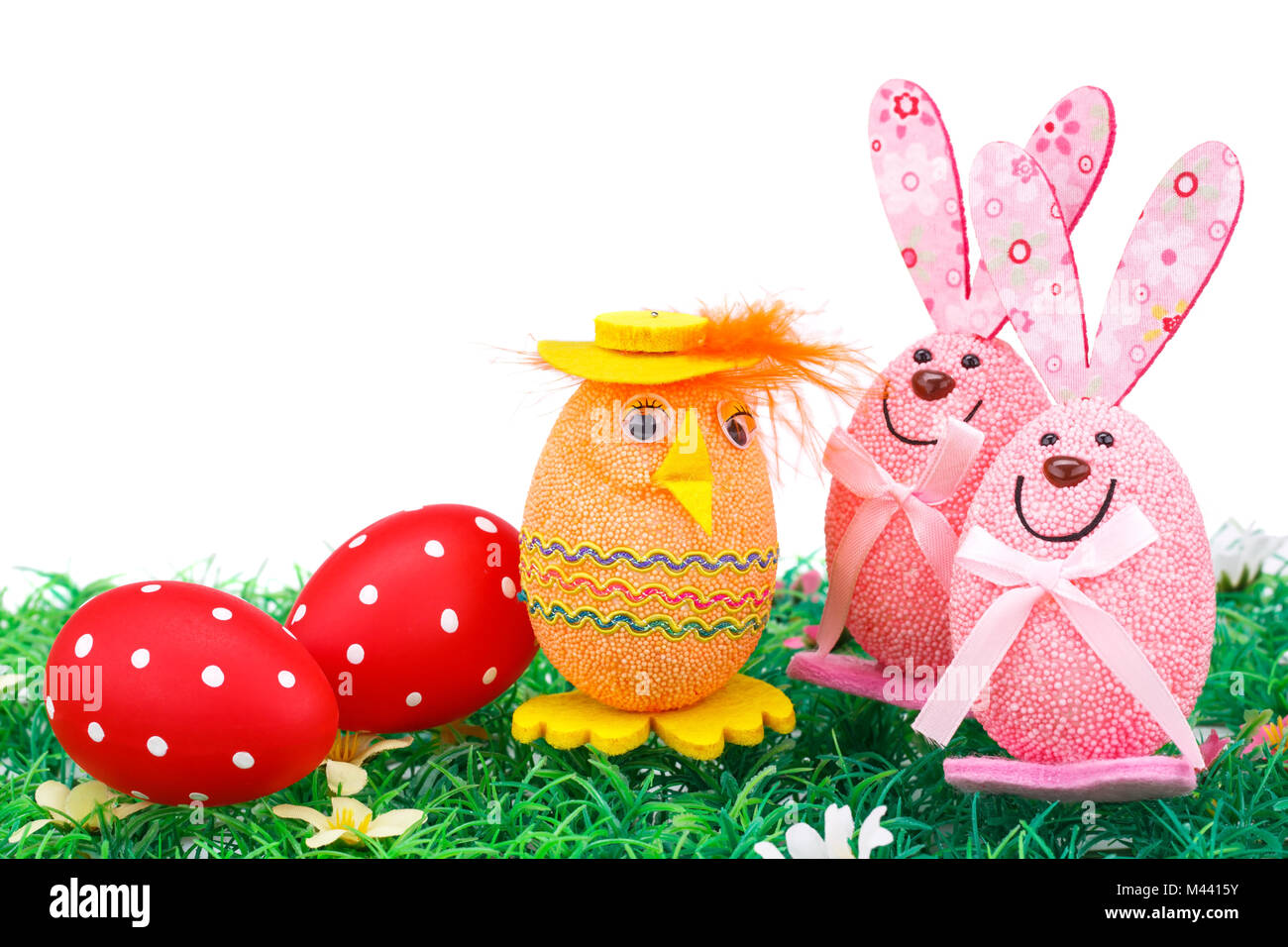 Easter eggs and bunnies decoration on artificial grass Stock Photo - Alamy