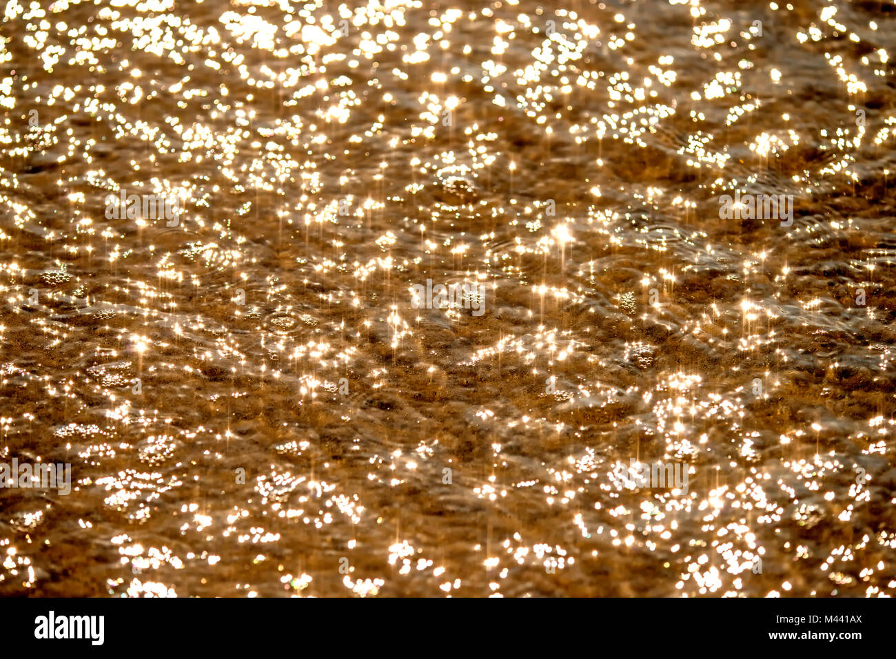Water of the sea with sun reflections Stock Photo - Alamy