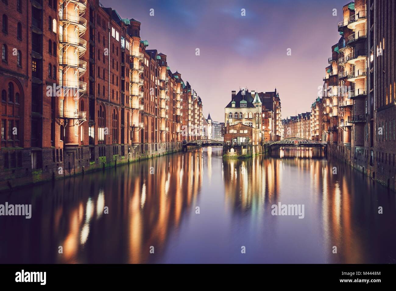 Historical buildings of the warehouse district at sunset. Speicherstadt is tourist popular place in Hamburg (Germany) on the UNESCO World Heritage Sit Stock Photo