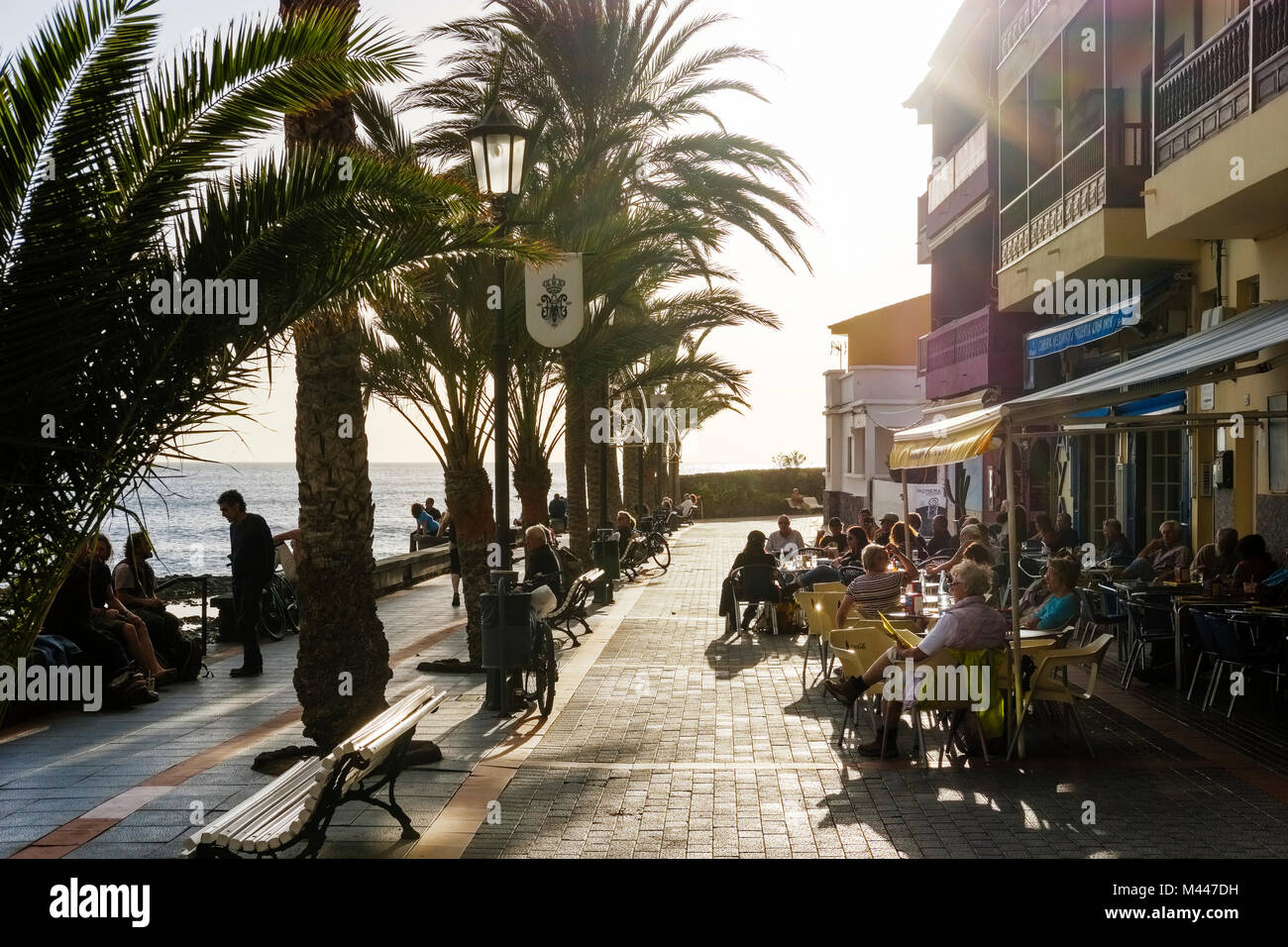 Oceanfront promenade with café and outdoor dining,La Playa,Valle Gran Rey,La Gomera,Canary Islands,Spain Stock Photo