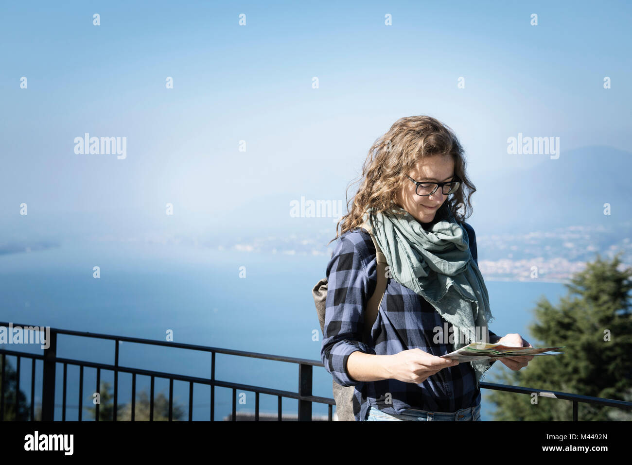 Woman looking at folding map, San Zeno di Montagna, Veneto, Italy, Europe Stock Photo