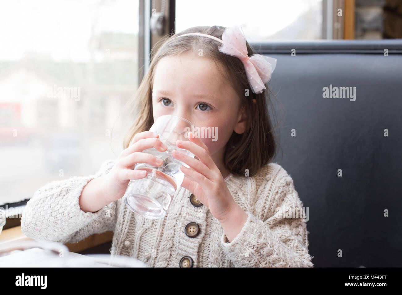 Girl drinking glass of water Stock Photo