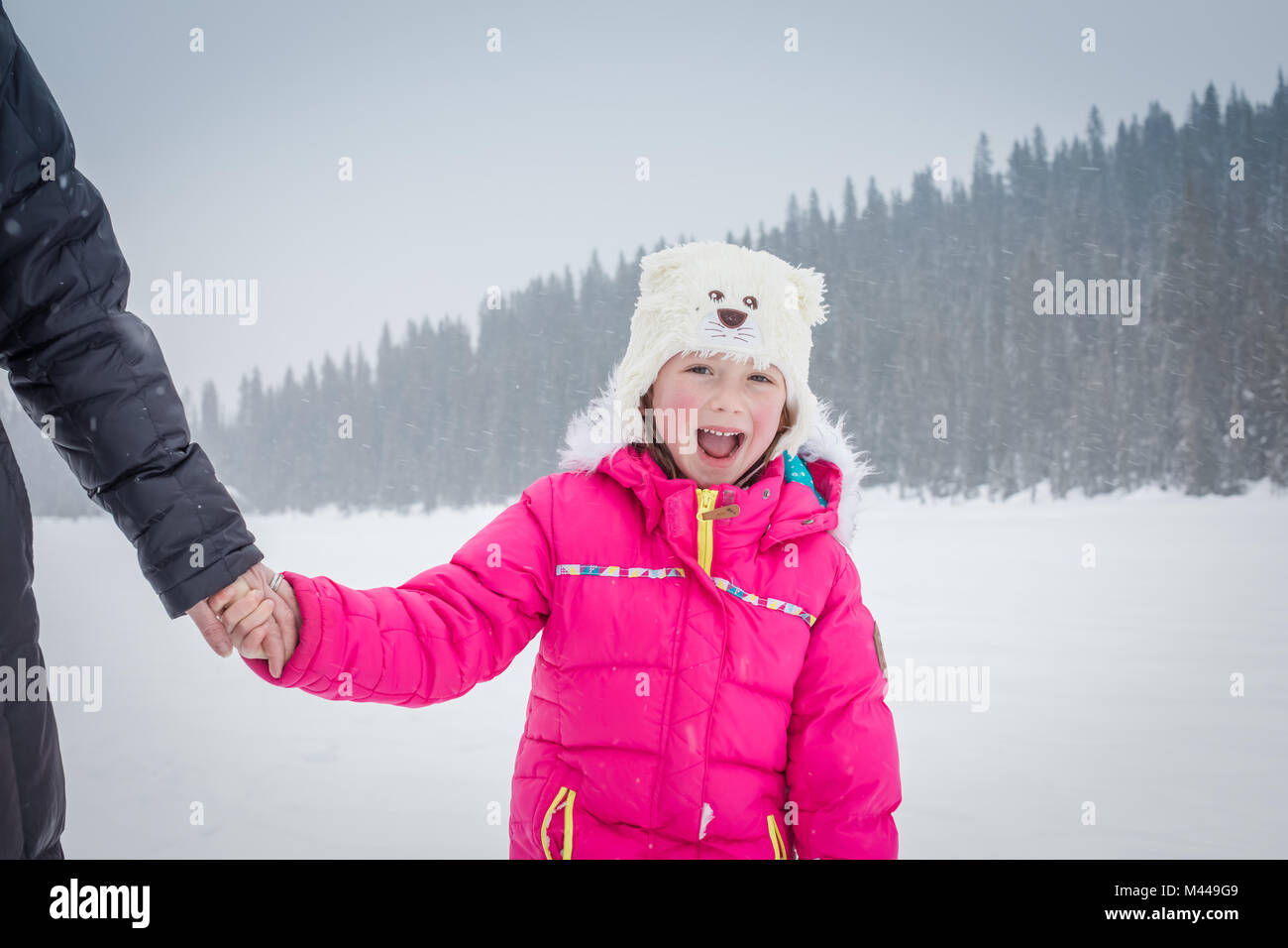Mother and daughter on frozen Lake Louise, Canada Stock Photo