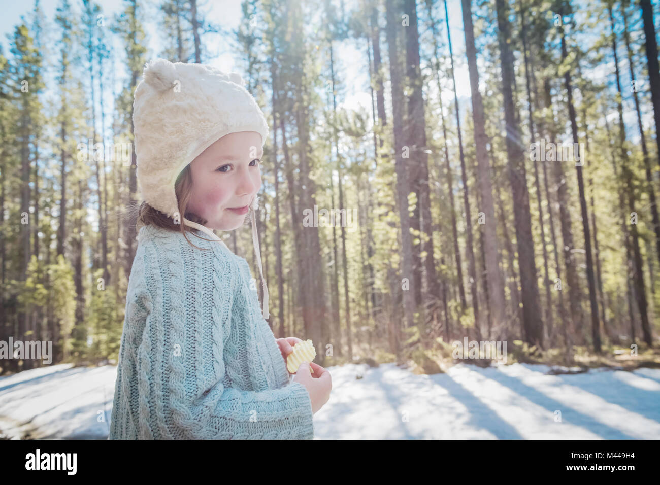 Girl with hat in forest, Alberta, Canada Stock Photo