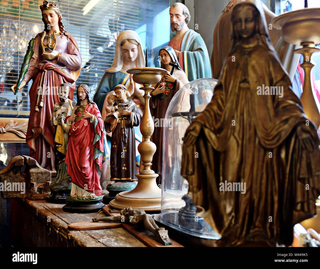 Religious figures displayed on table Stock Photo