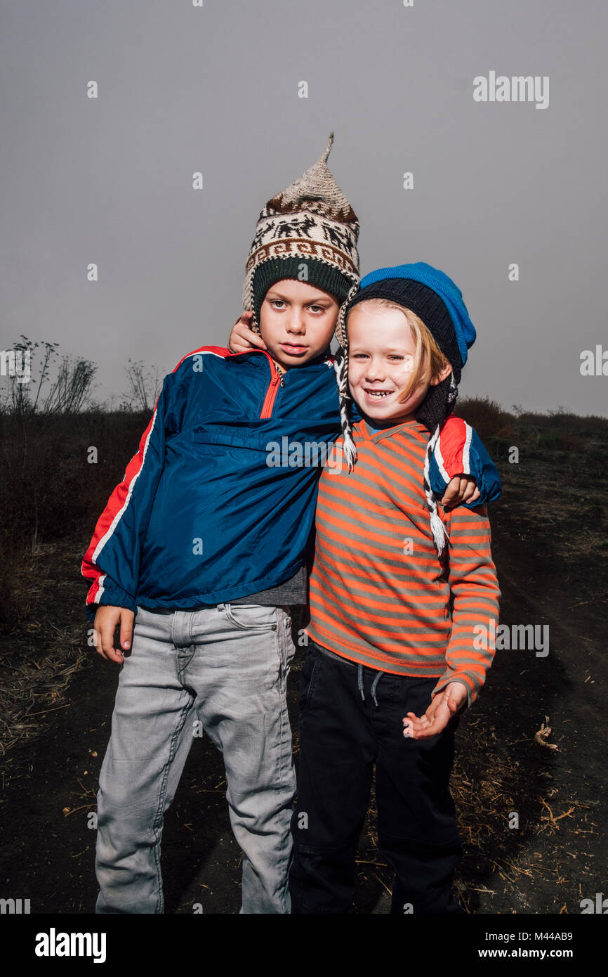 Two children arms around each other hi-res stock photography and images ...