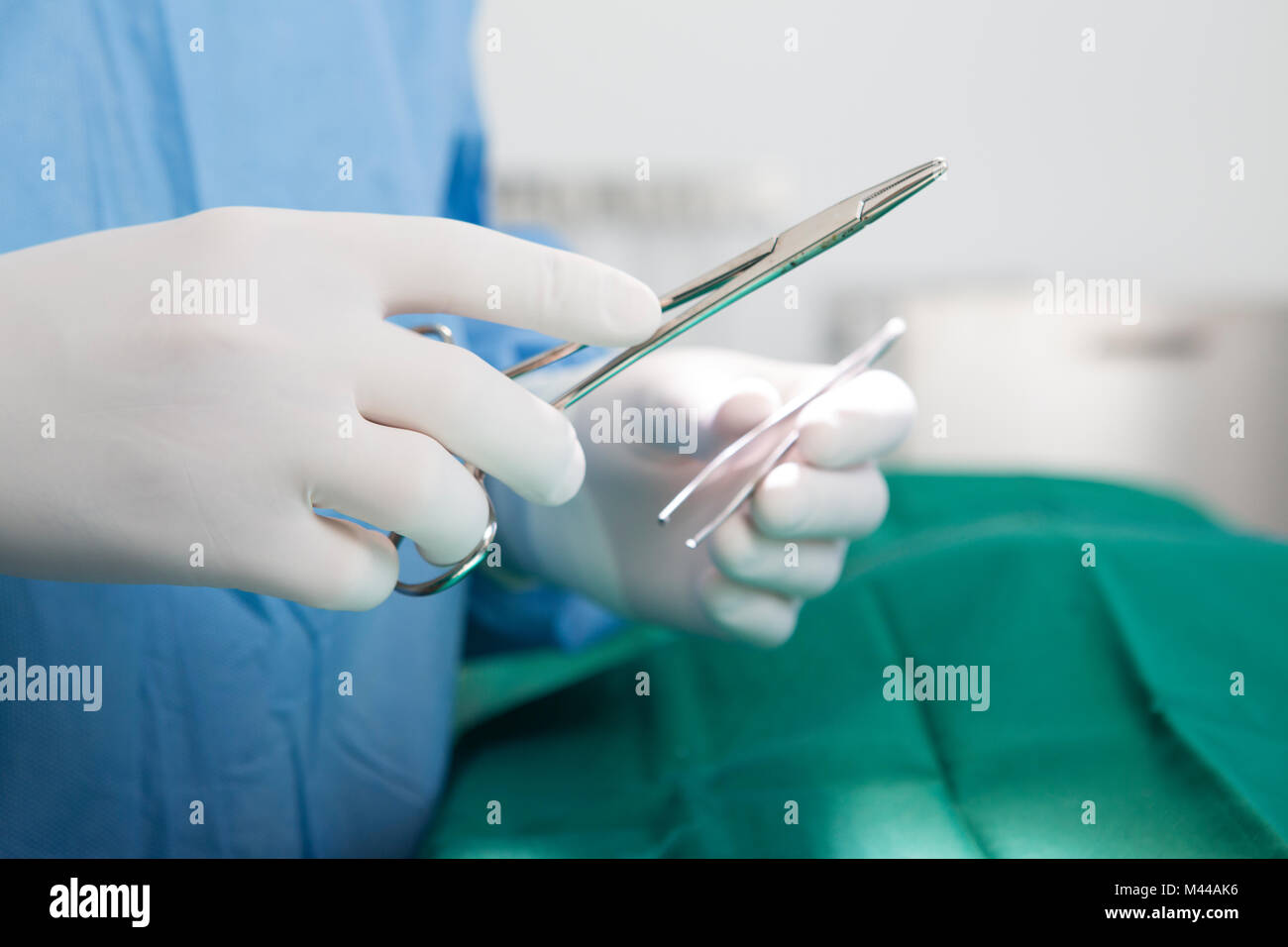 Vet holding surgery instruments Stock Photo