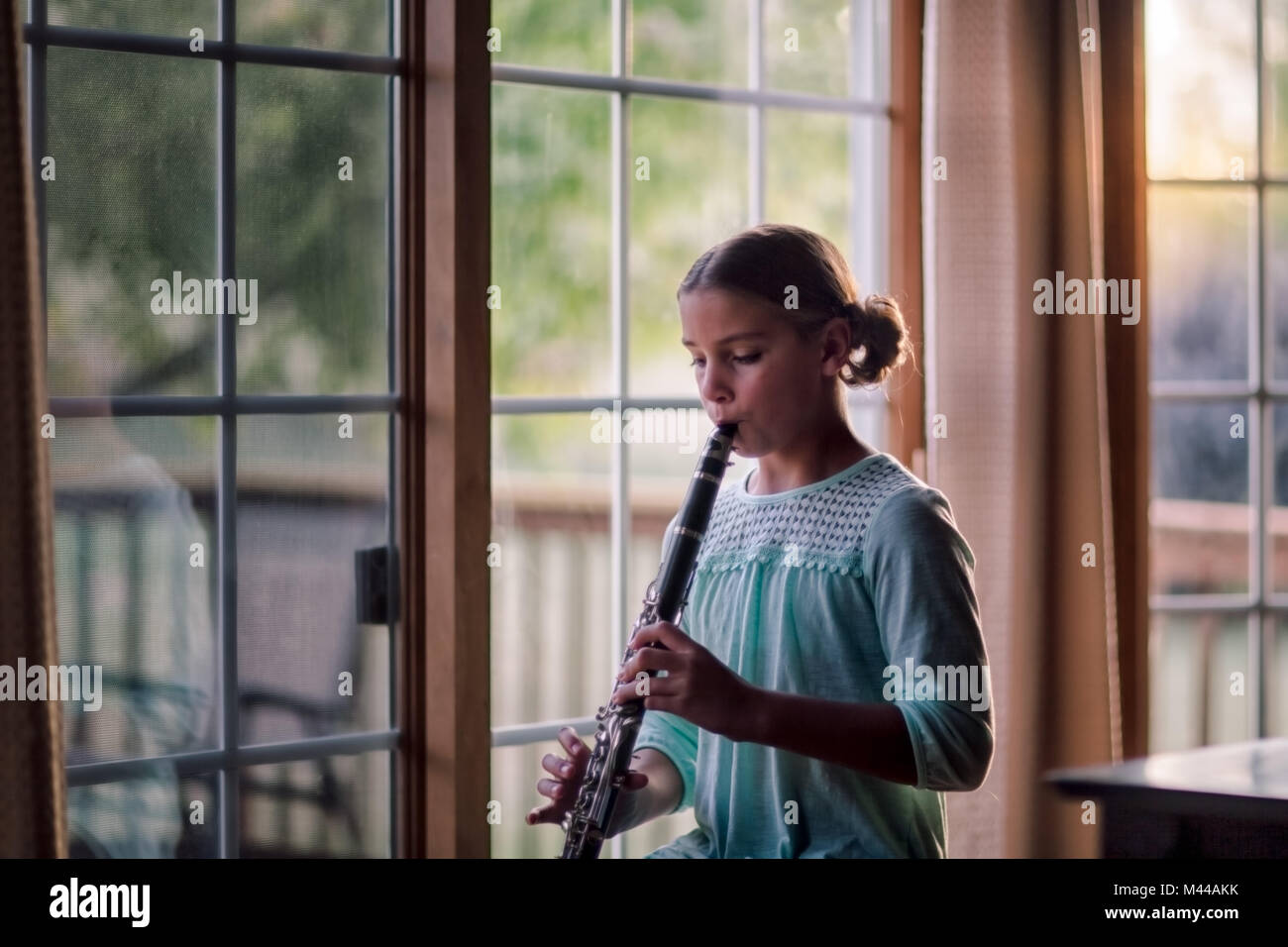 Young clarinettist playing her clarinet Stock Photo
