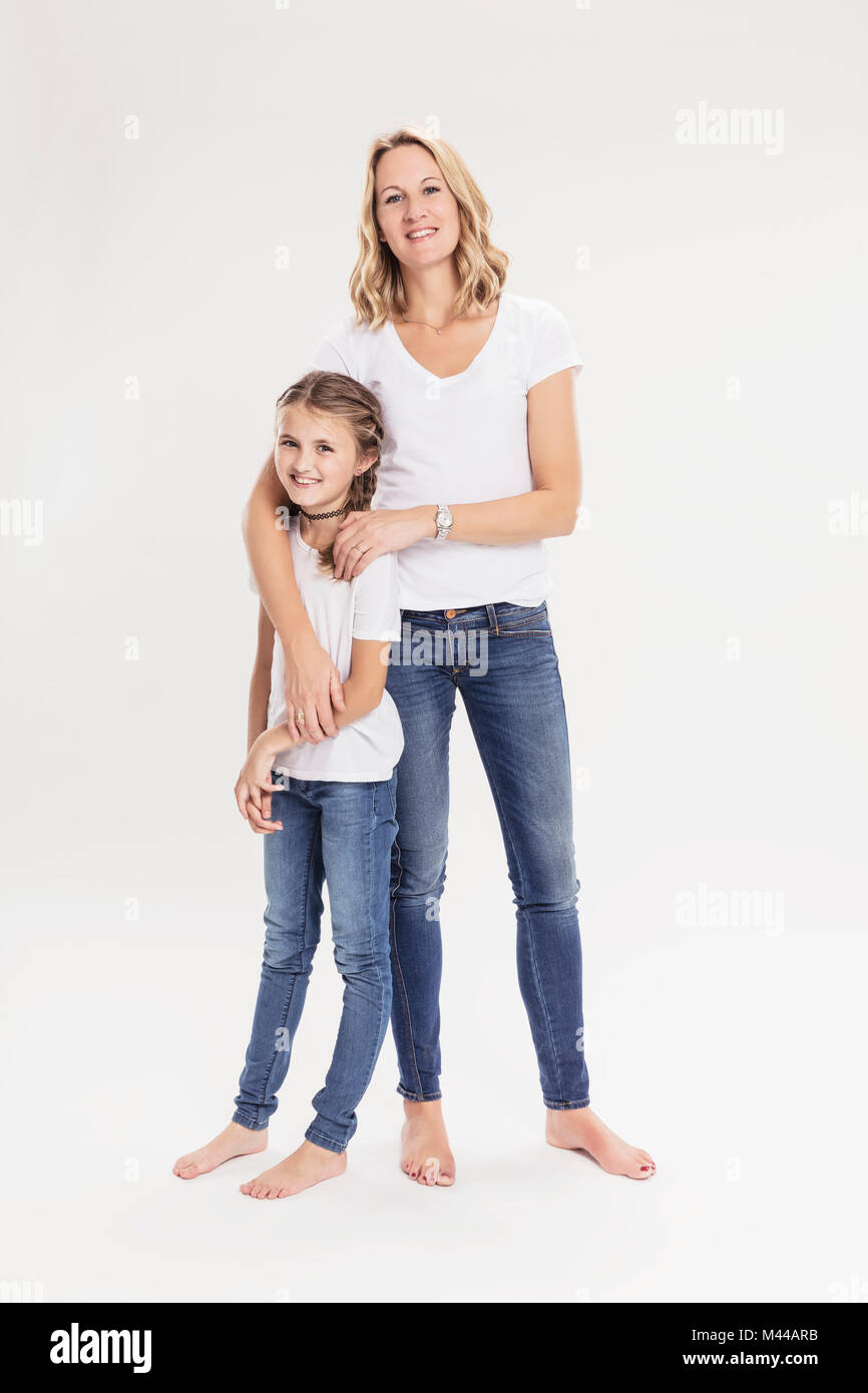 Studio portrait of mature woman with daughter, full length Stock Photo