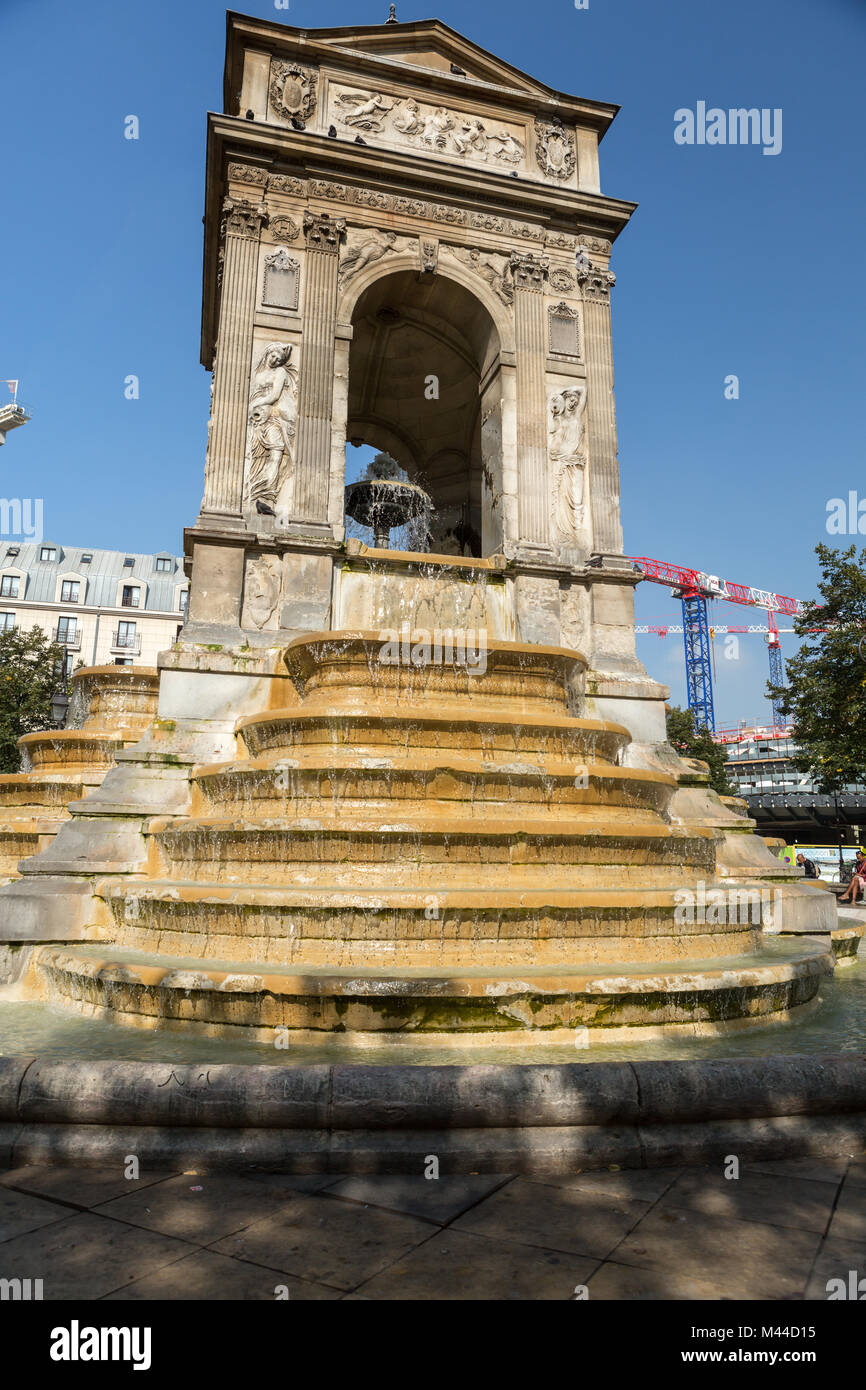 Paris - The Fontaine des Innocents is a monumental public fountain located on the place Joachim-du-Bellay in the Les Halles district in Paris, France Stock Photo