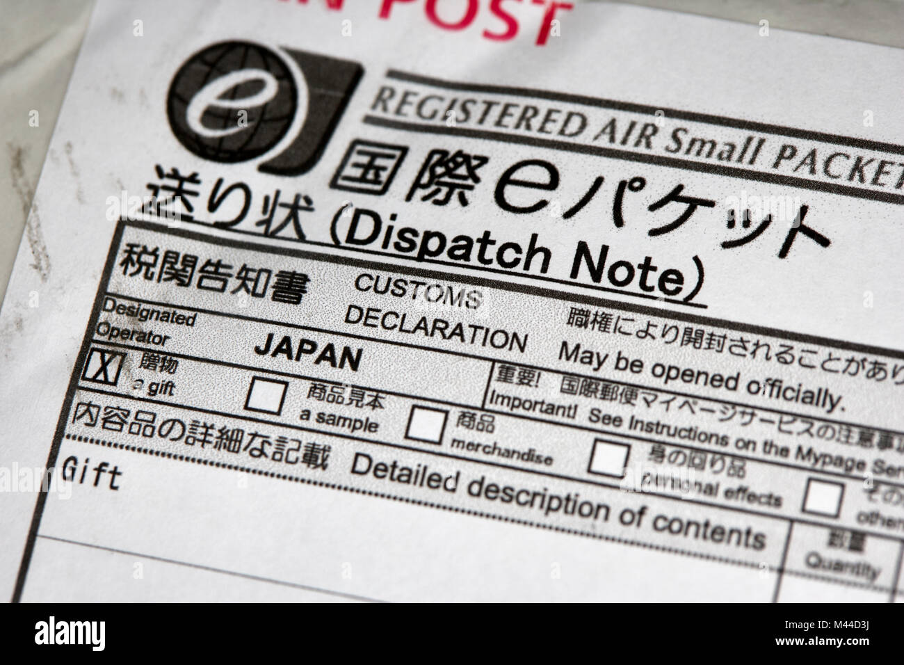 Japan post customs declaration with small packet marked as a gift Stock Photo