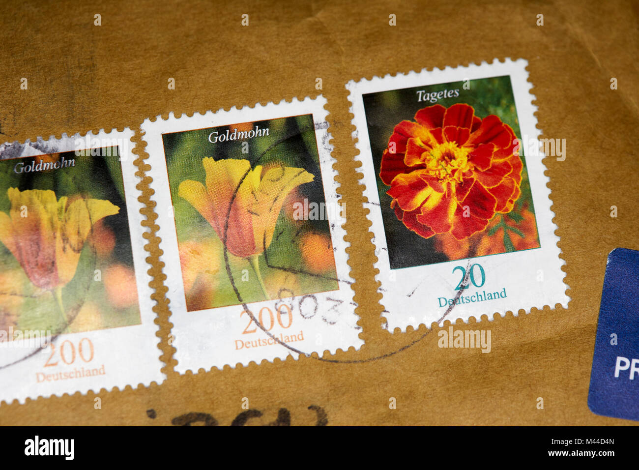 postmark and stamps on a small packet sent from Germany Stock Photo