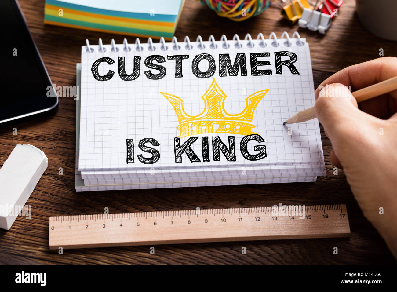 Close Up Of A Person Drawing Customer Is King Chart On Note Book Over The Desk Stock Photo Alamy