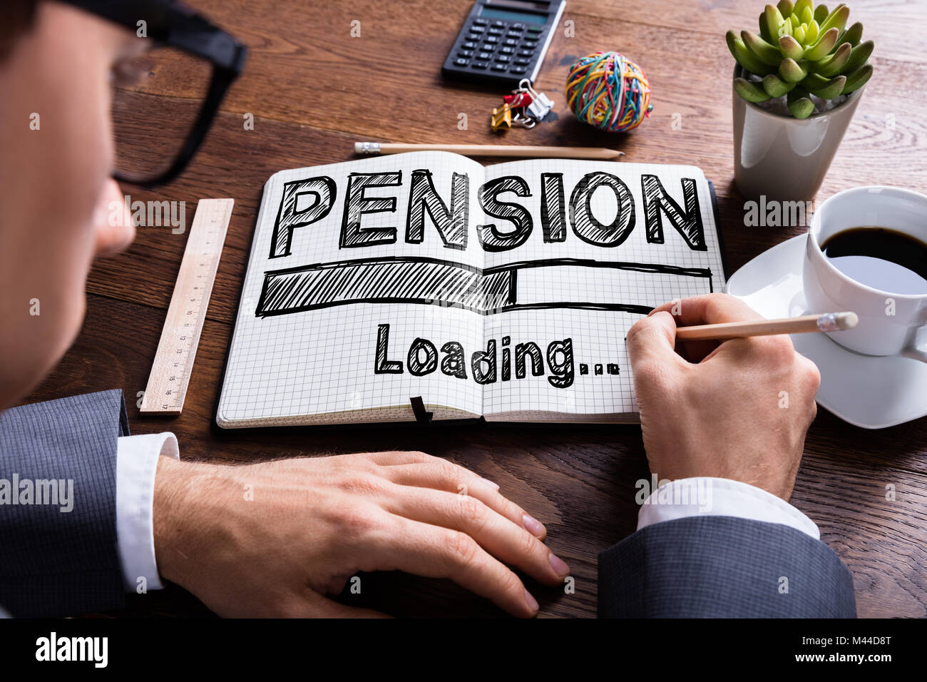 close-up-of-a-businessperson-drawing-loading-pension-concept-on