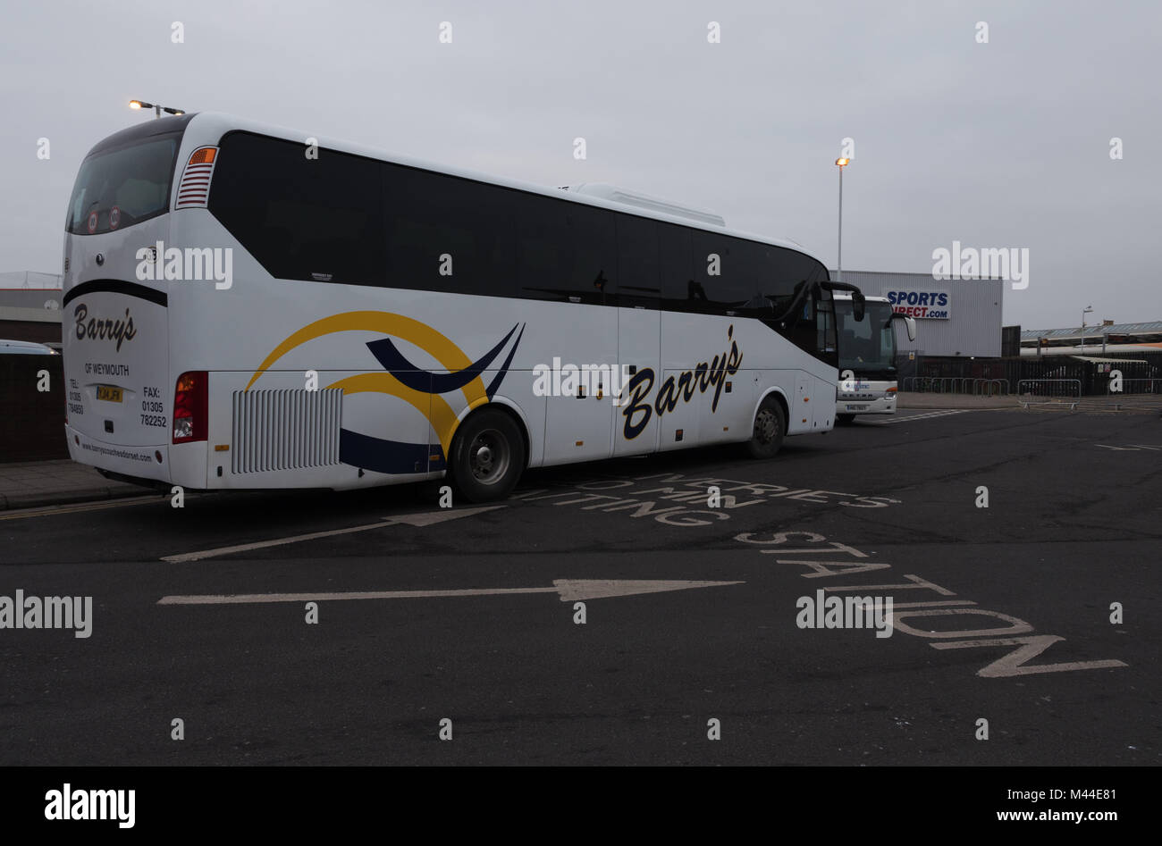 Barry's Coaches Coach outside Weymouth Train station on rail replacement duties, during a rail strike Stock Photo