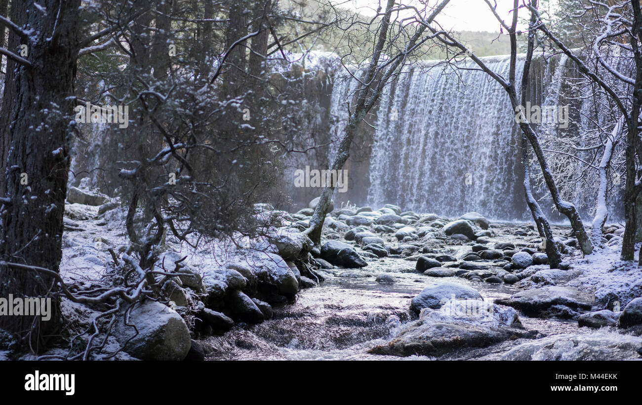 Snowy landscape with river and waterfall in the background. frozen ...