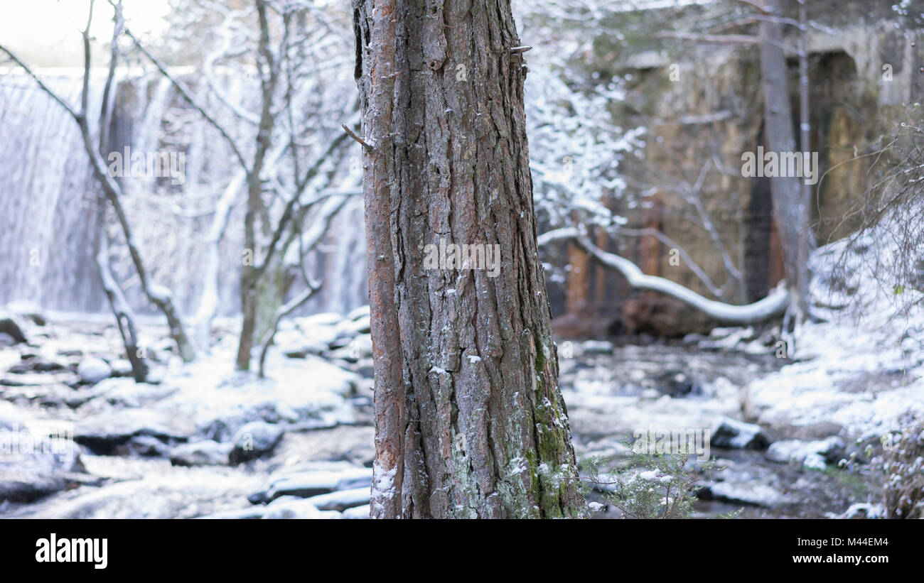 Snowy landscape with river and waterfall in the background. frozen ...