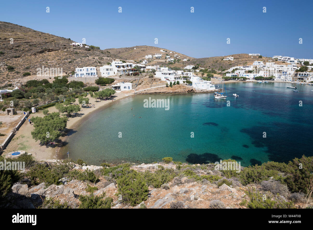 View over crystal clear sea and sand beach on island's south east coast, Faros, Sifnos, Cyclades, Aegean Sea, Greek Islands, Greece, Europe Stock Photo