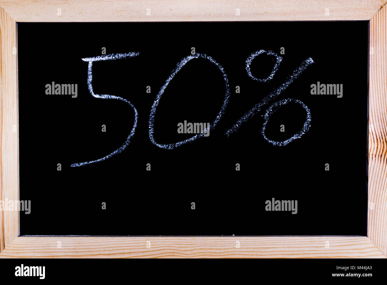 Blackboard with 50% written on it Stock Photo