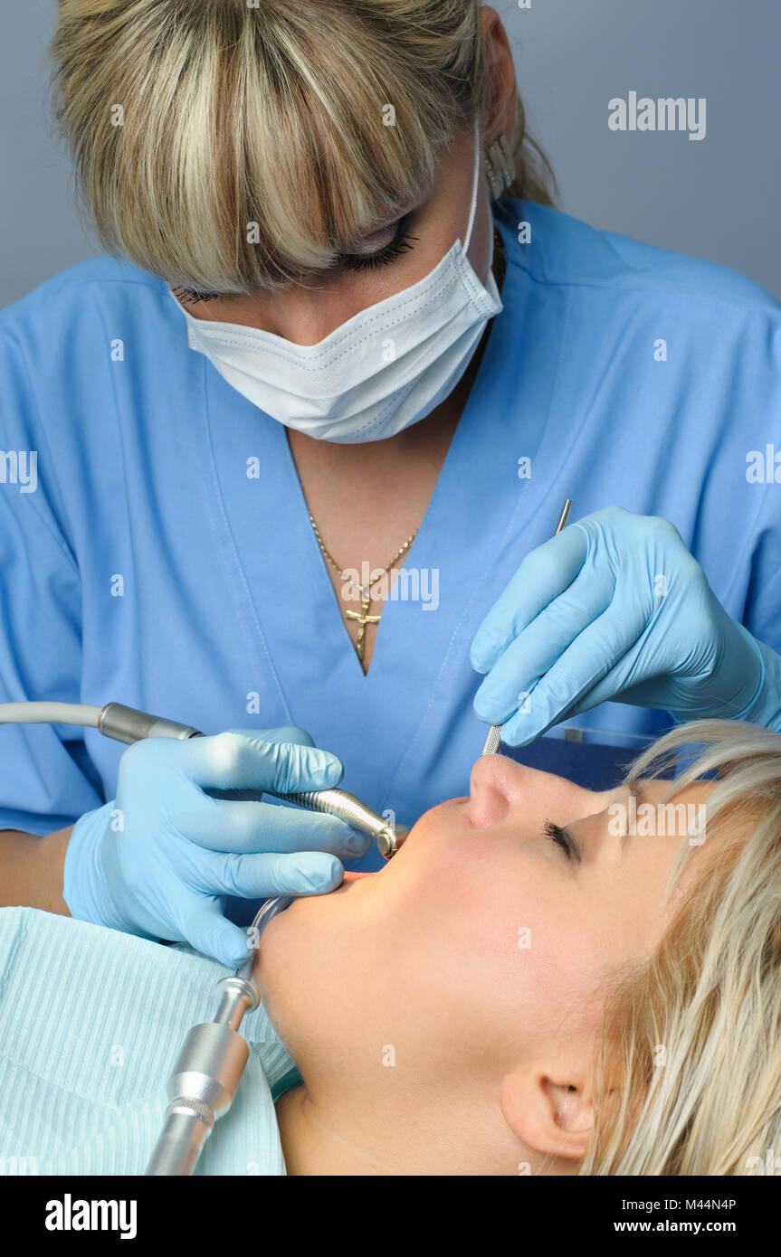 dentist with patient, dental drilling Stock Photo Alamy