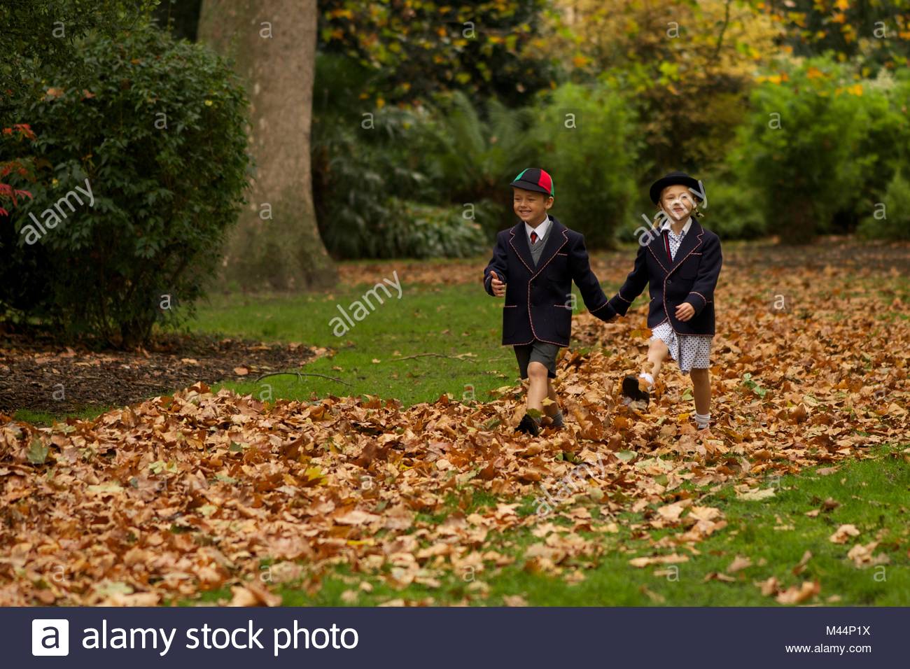 Brother And Sister Walking Hand In Hand To School Stock Photos ...