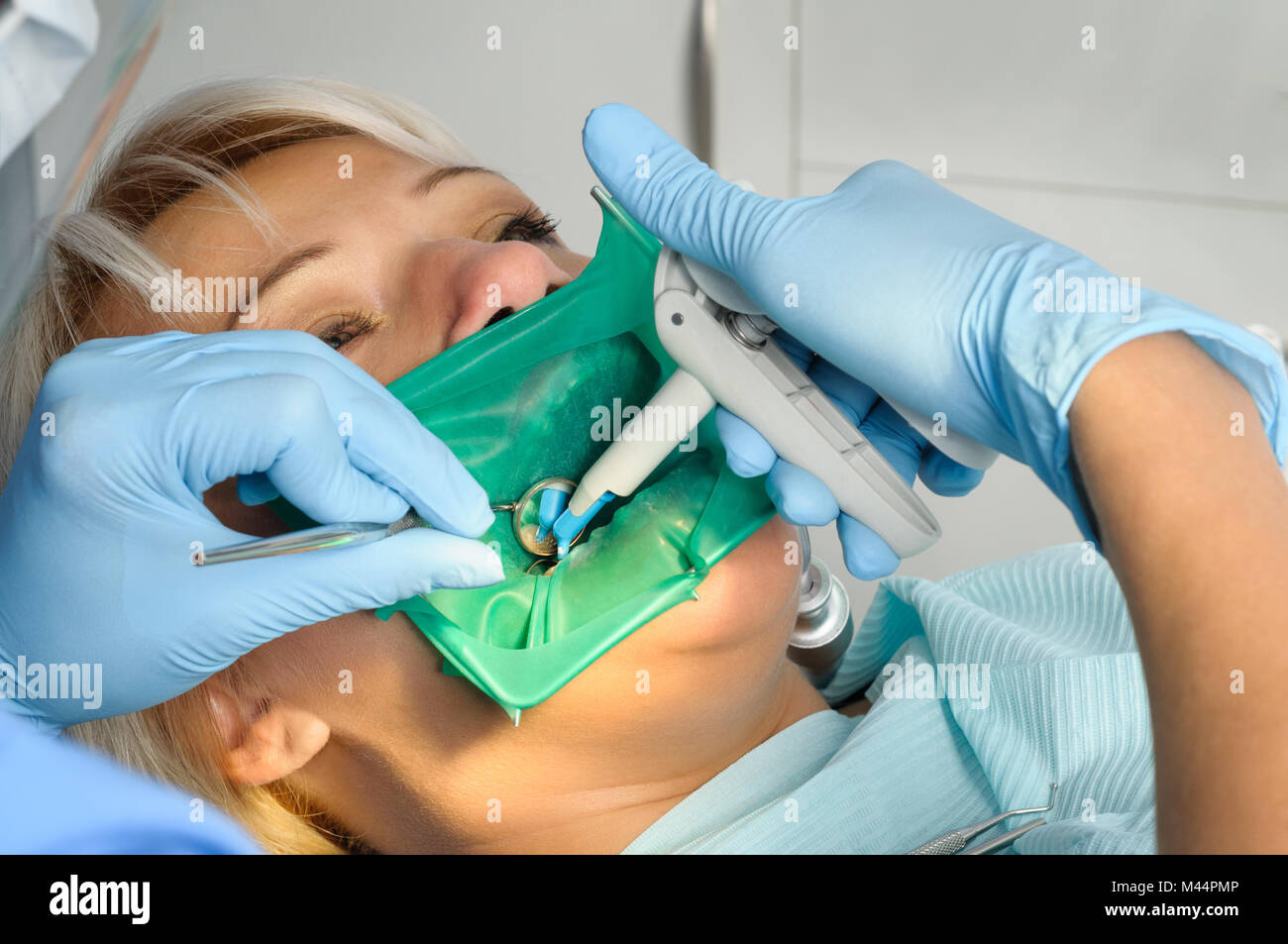 dentist with patient, cleaning and curing Stock Photo Alamy