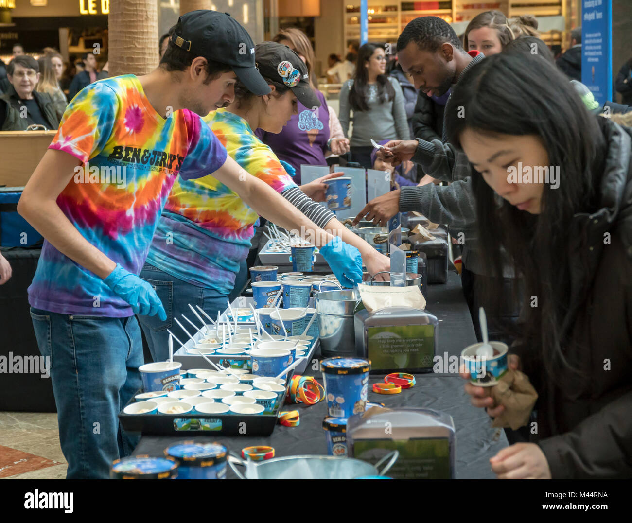 Thousands of ice cream lovers invade the Brookfield Place Winter Garden for Ben & Jerry's New Creations Launch Party in New York on Wednesday, February 7, 2018. The branding event introduces a new product line for Unilever's Ben & Jerry's with only 140-160 calories per serving. Called Moo-phoria, the light ice cream line comes in three flavors, 'Chocolate Milk & Cookies', Caramel Cookie Fix', and 'P.B. Dough', organic and made with non-GMO ingredients. The product line is a response to the popular Halo Top which gaining market share. (© Richard B. Levine) Stock Photo