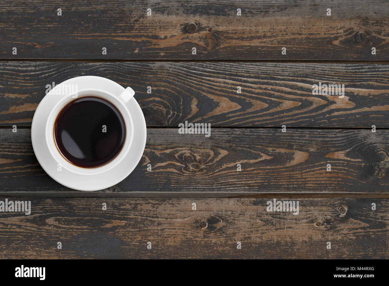 Black coffee cup on dark wooden table top view Stock Photo