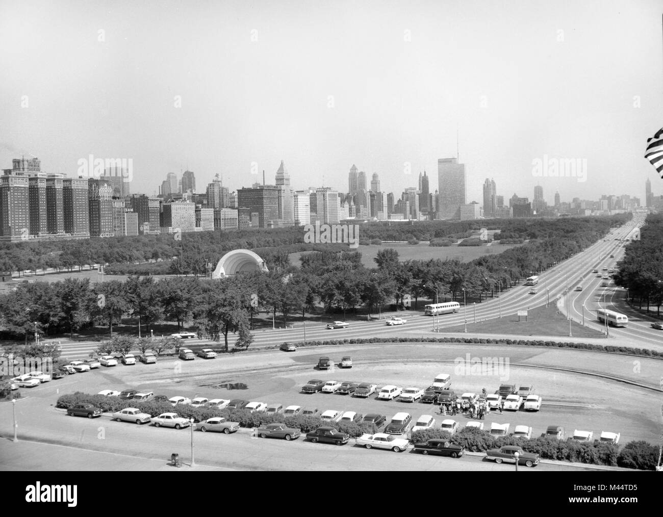 The skyline of Chicago is seen from the steps of the Field Museum looking northbound over Grant Park, ca. 1961. Stock Photo