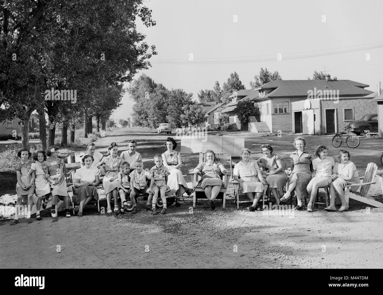 A group of mostly women and children protest truck traffic in their neighborhood in Illinois, ca. 1950. Stock Photo