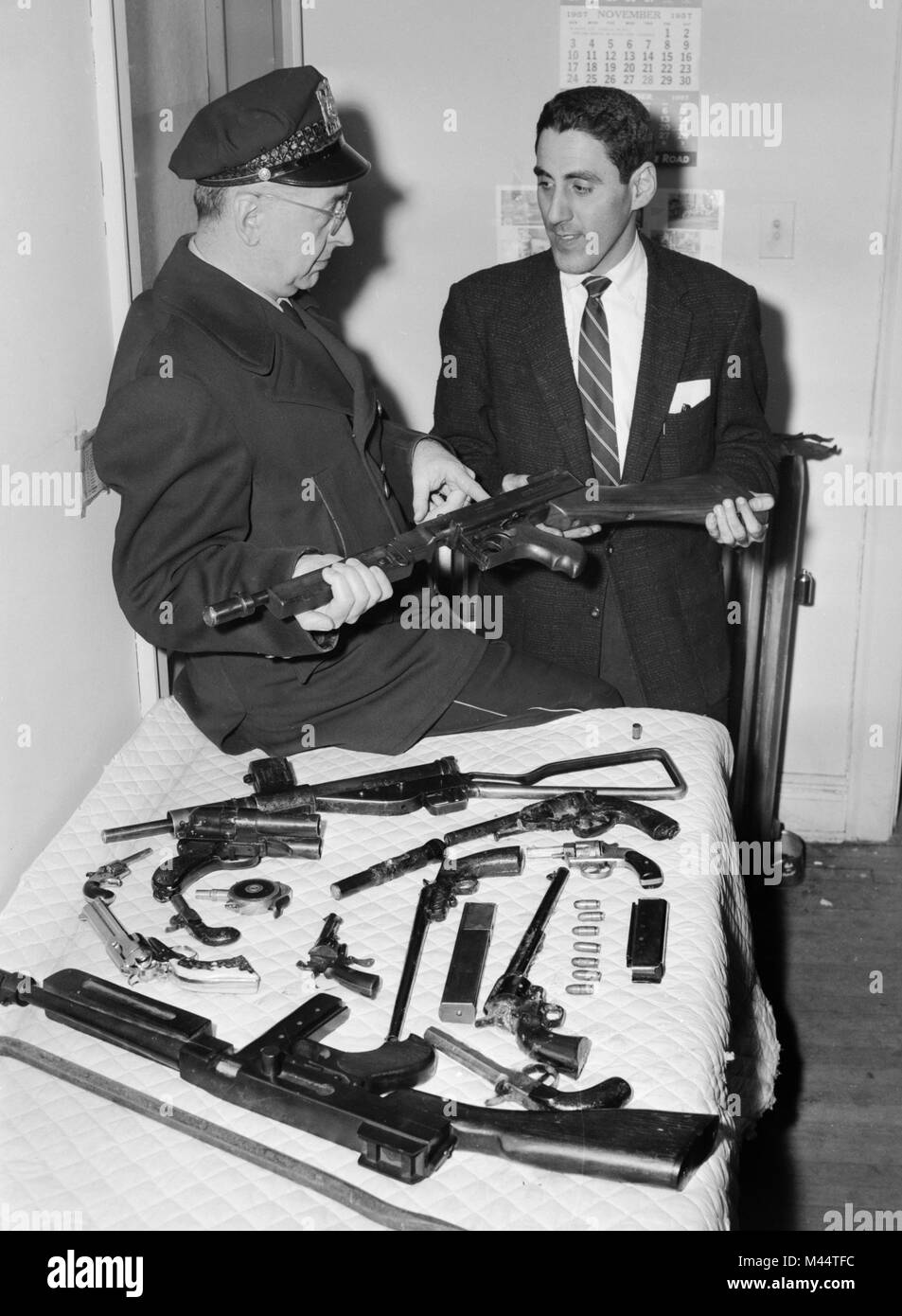 Police haul of illegal guns and weapons after a raid in Chicago, ca. 1957 Stock Photo Alamy