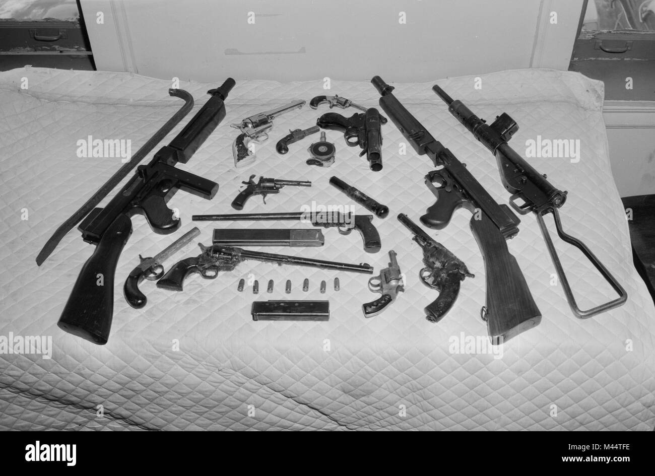 Police haul of illegal guns and weapons after a raid in Chicago, ca. 1957. Stock Photo