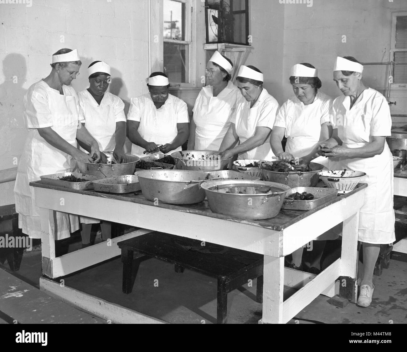 Cooks in a Chicago hotel kitchen prepare food, ca. 1958. Stock Photo