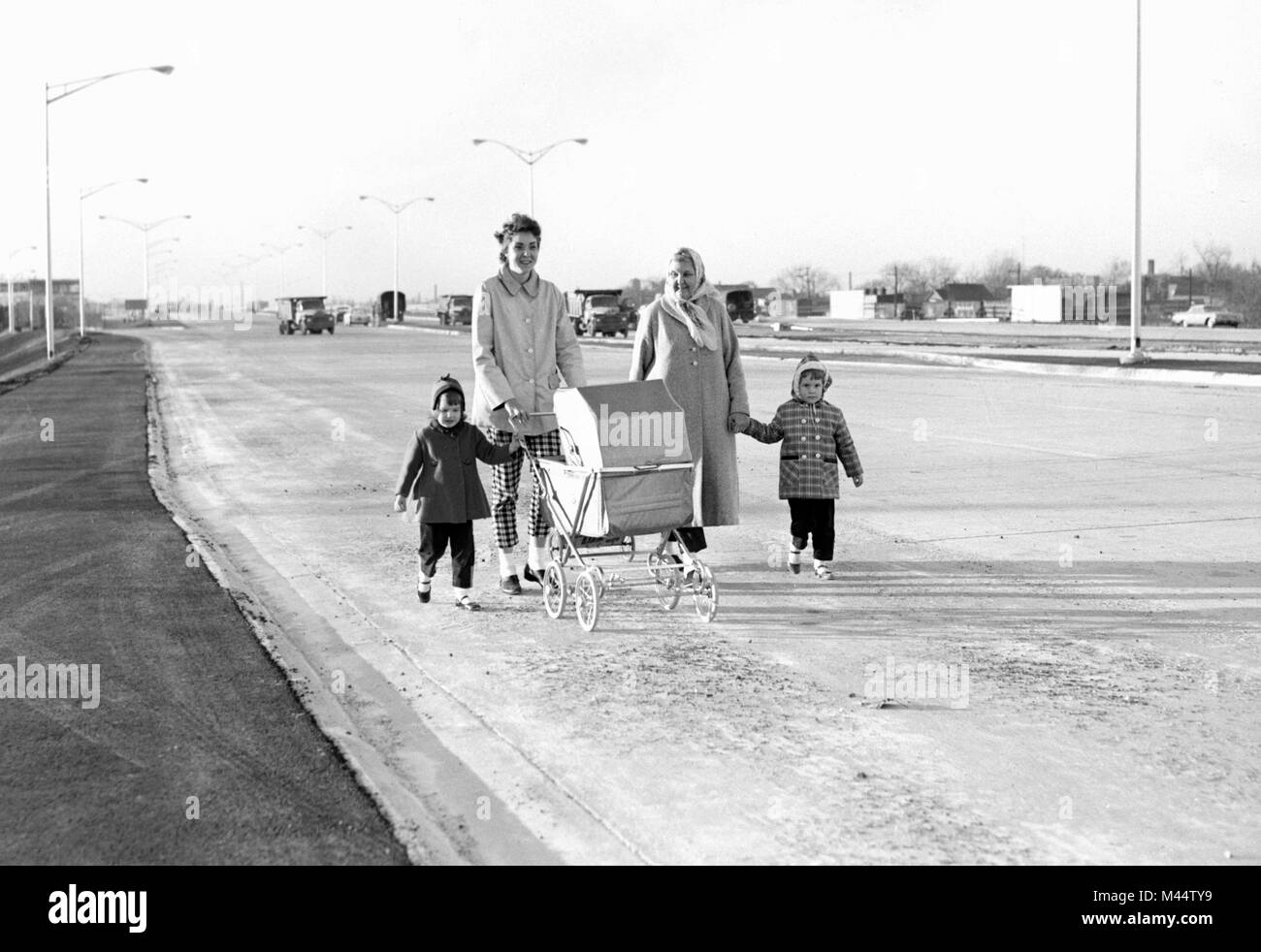 Family strolls on the last stretch of the unopened NW Expressway (Kennedy) in 1960. Stock Photo
