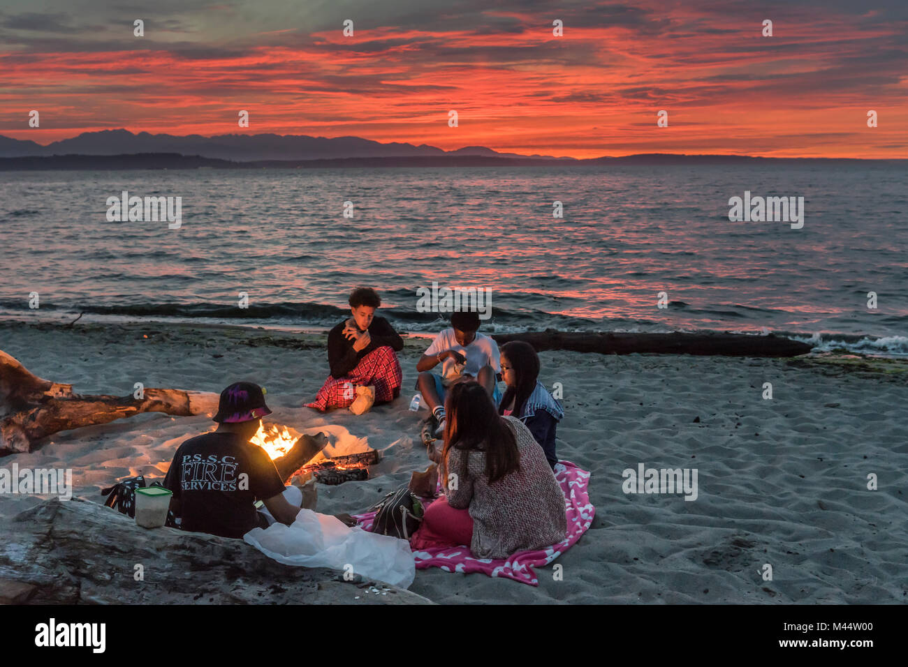 Family Sitting Around Fire Stock Photos Family Sitting Around