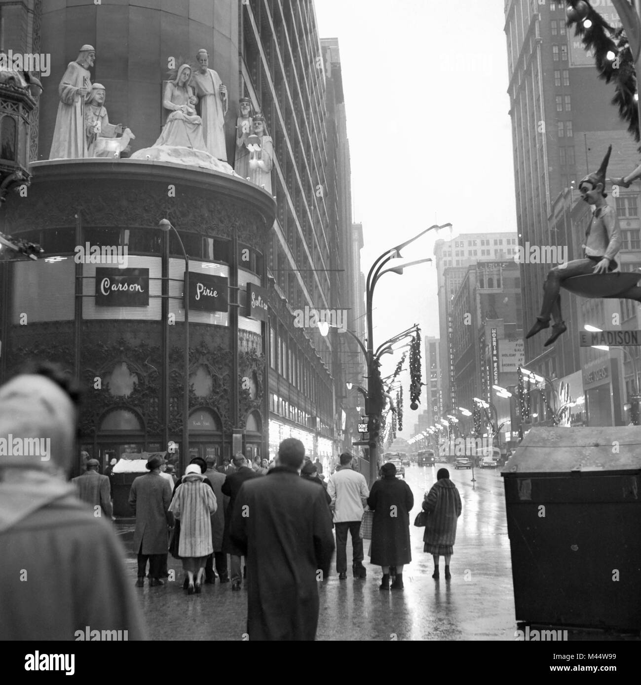 It's a warm and foggy day at the corner of State and Madison in Chicago during Christmas season, ca. 1968. Stock Photo