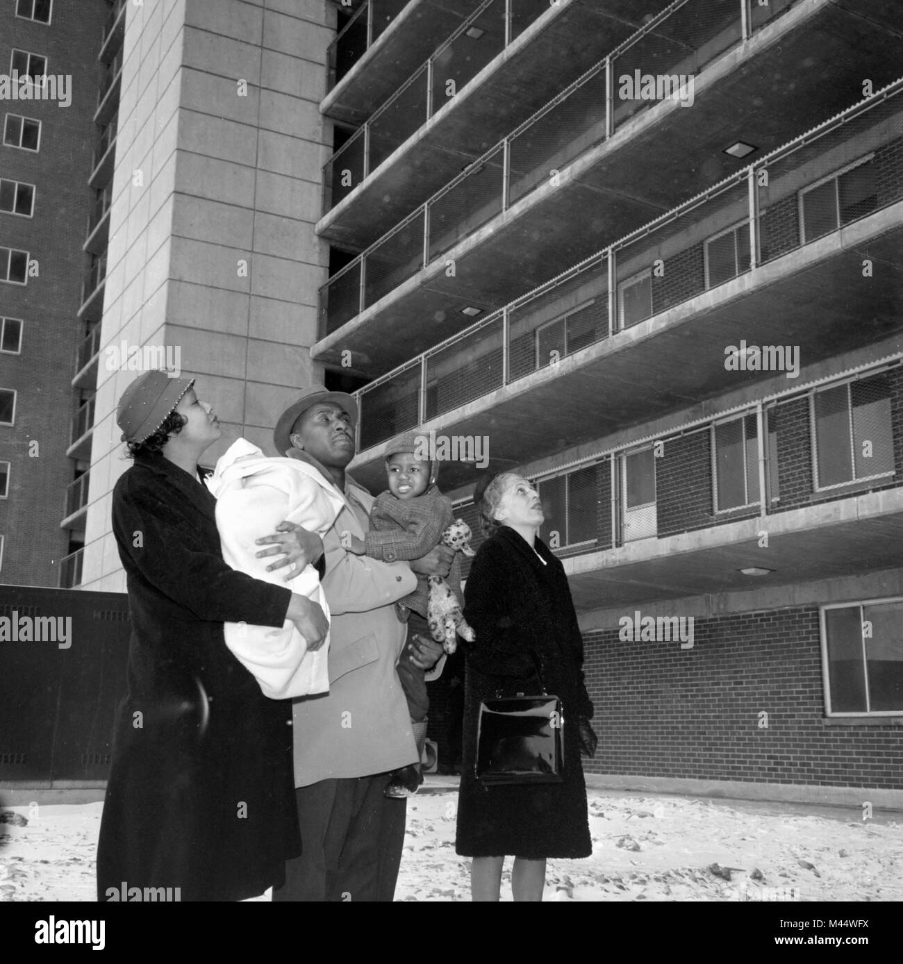 An African American family surveys their new home in the newly constructed Robert Taylor homes on Chicago’s South Side in 1962. Stock Photo