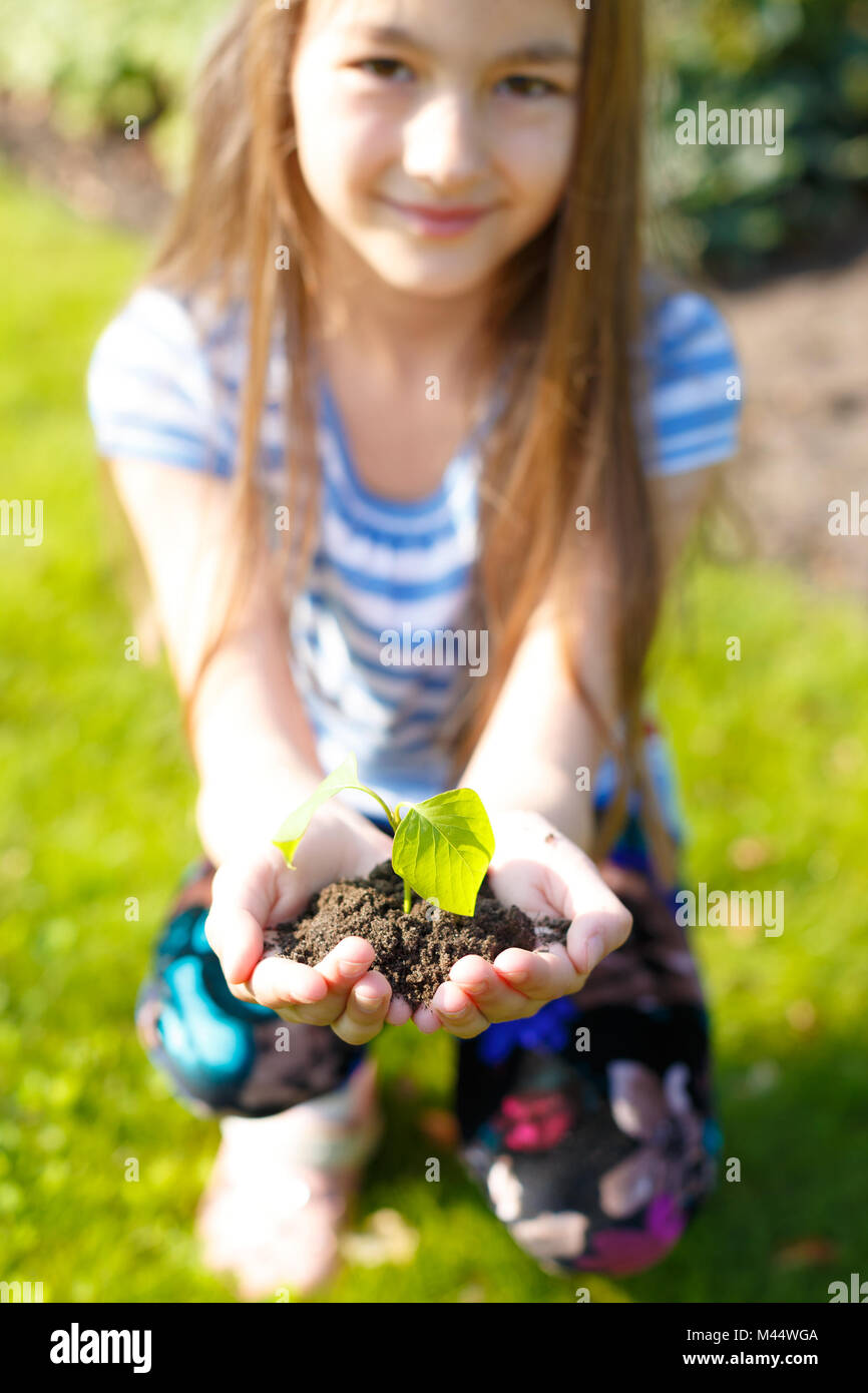 Girl planting tree hi-res stock photography and images - Alamy