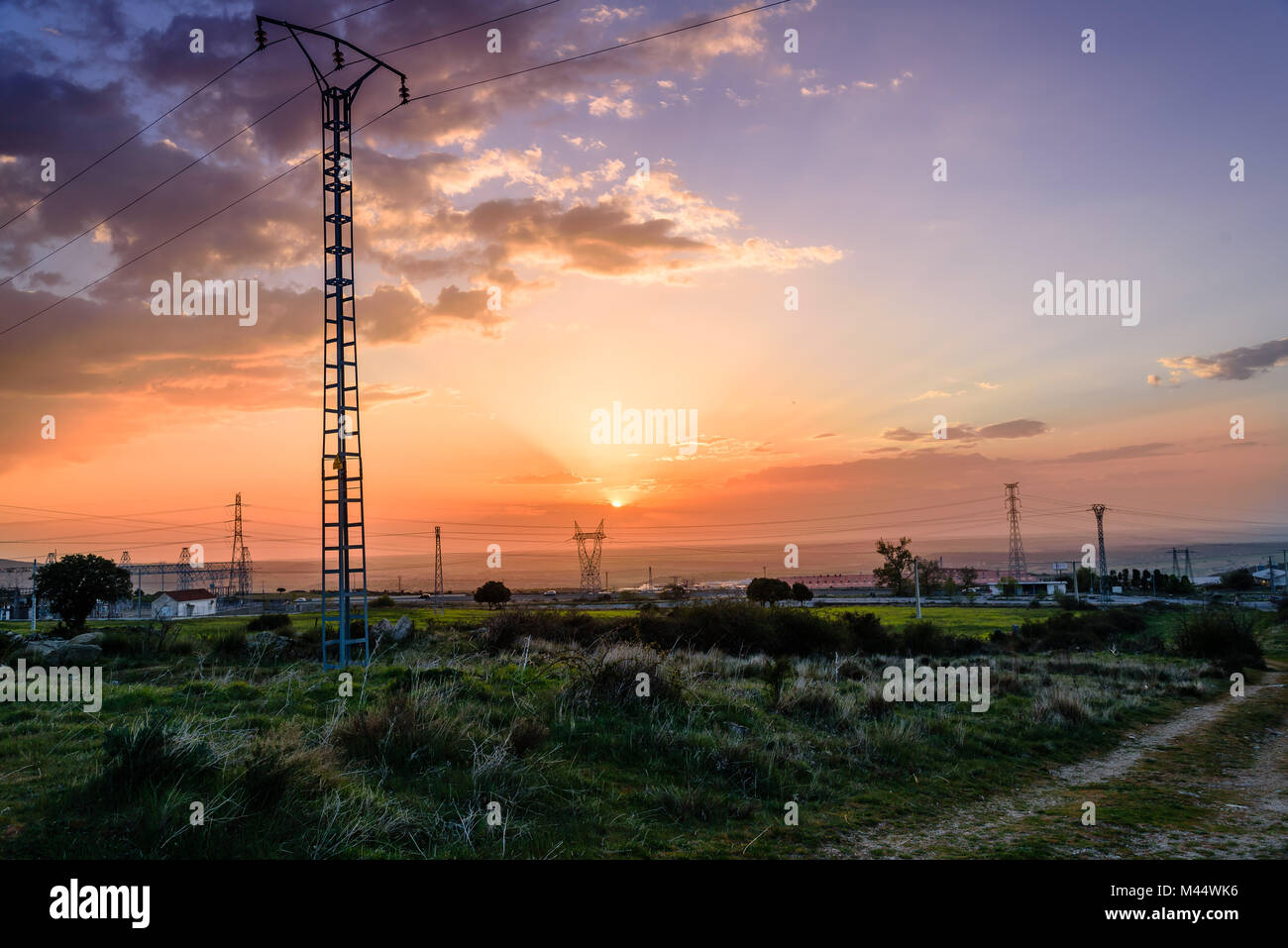 Electrical Power Lines and Pylons in the countryside at sunset Stock ...