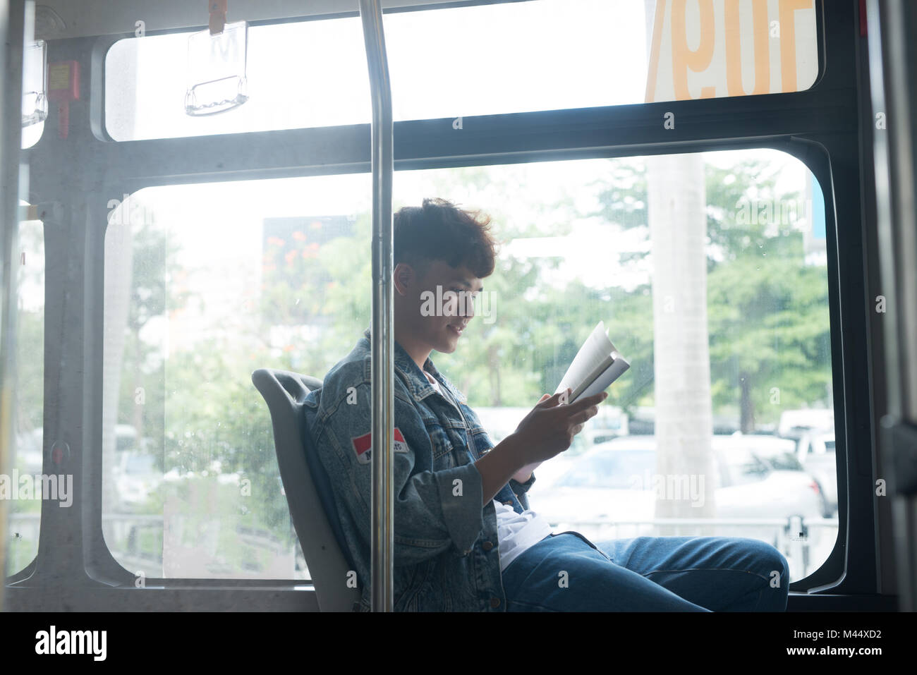 Public transport. people in the bus. Asian man sitting inside city bus. Stock Photo