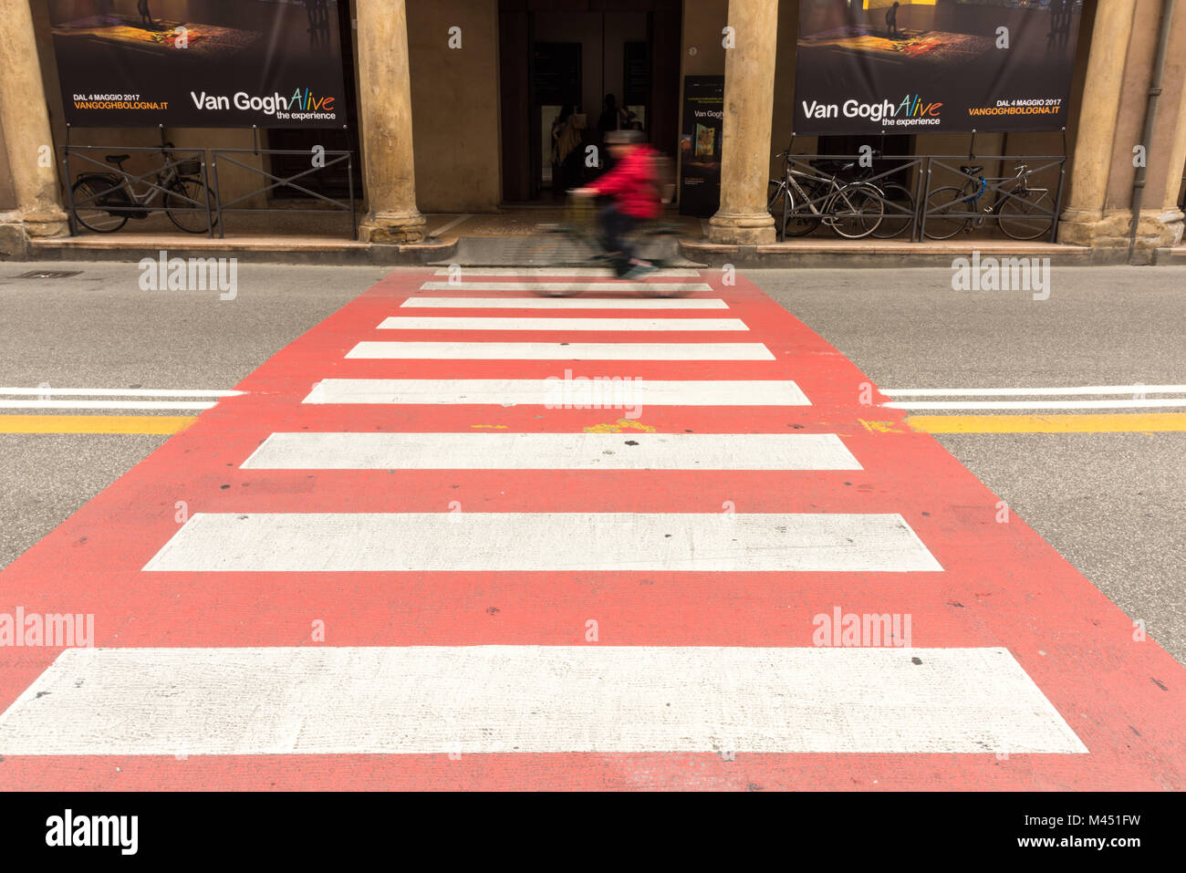 A Red And White Pedestrian Crossing In A Street In Bologna Italy