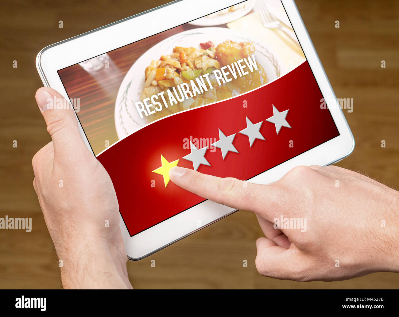 Bad restaurant review. Disappointed and dissatisfied customer giving terrible rating with tablet on an imaginary criticism site, application. Stock Photo