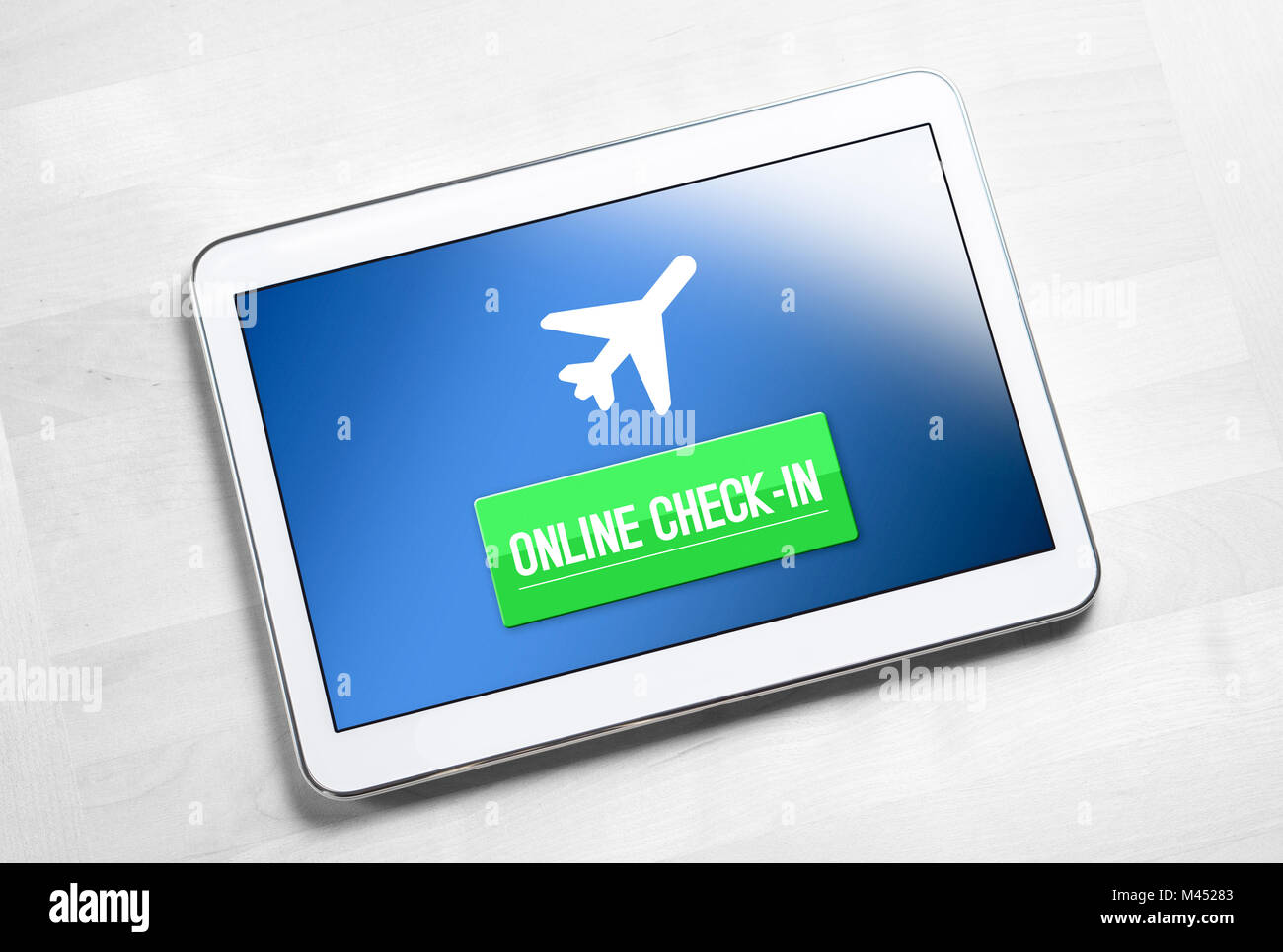 Online check in application or website on tablet. Mobile device on wooden table ready to checking in to flight on internet. Web self service provided. Stock Photo