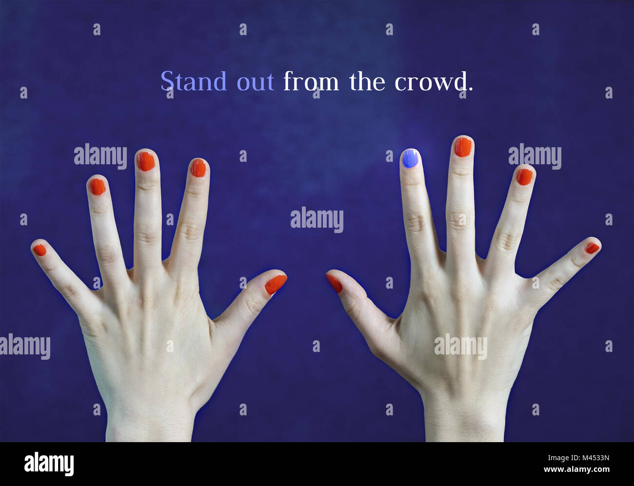 Stand out from the crowd. Originality and creativity concept with blue background. One different nail color in finger in caucasian hands. Red and blue Stock Photo