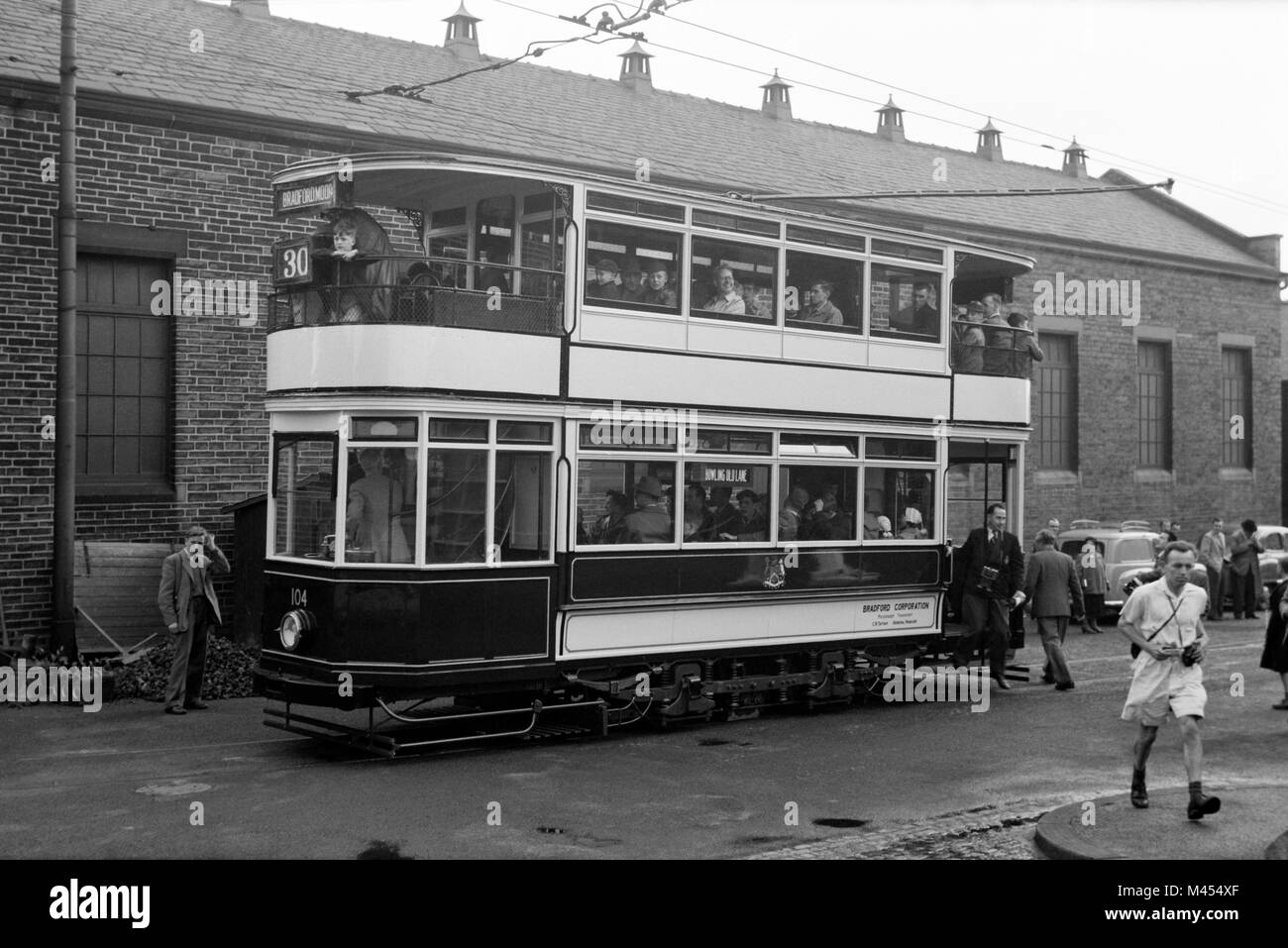 Photographers and enthusiasts take part in the 'Last Special Day' of the Bradford Corporations last tram No 104 on the final journey on May 6, 1950 Stock Photo