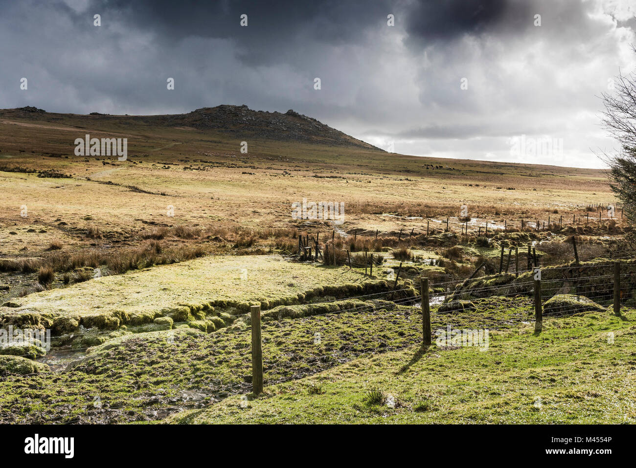 Cloudy sky over Rough Tor on Bodmin Moor in Cornwall. Stock Photo