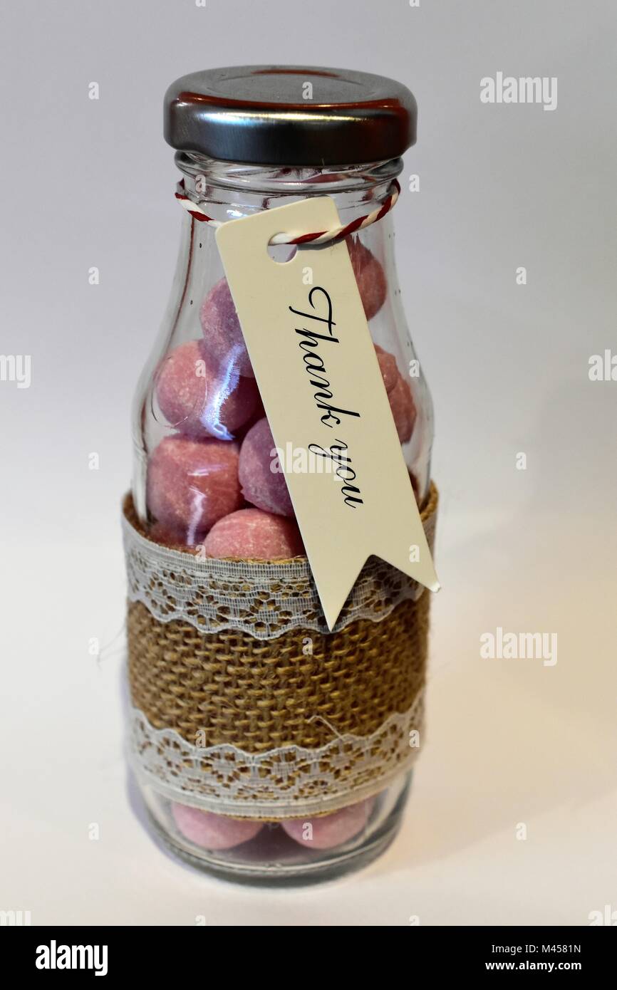 Sweets in glass jars / bottles / wedding favours Stock Photo