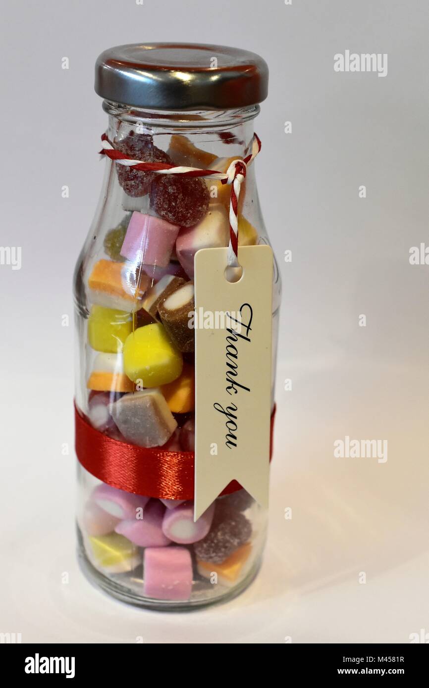Sweets in glass jars / bottles / wedding favours Stock Photo Alamy